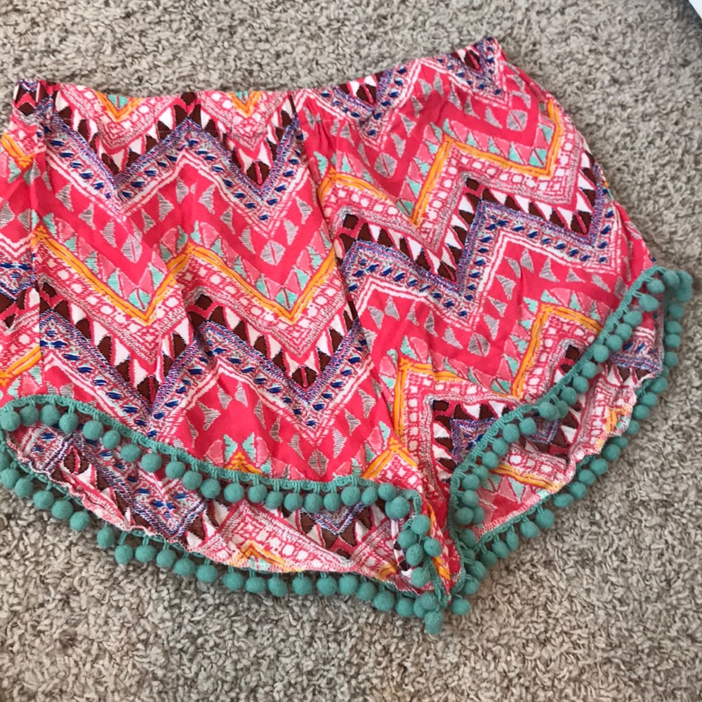 Patterned shorts with Pom poms